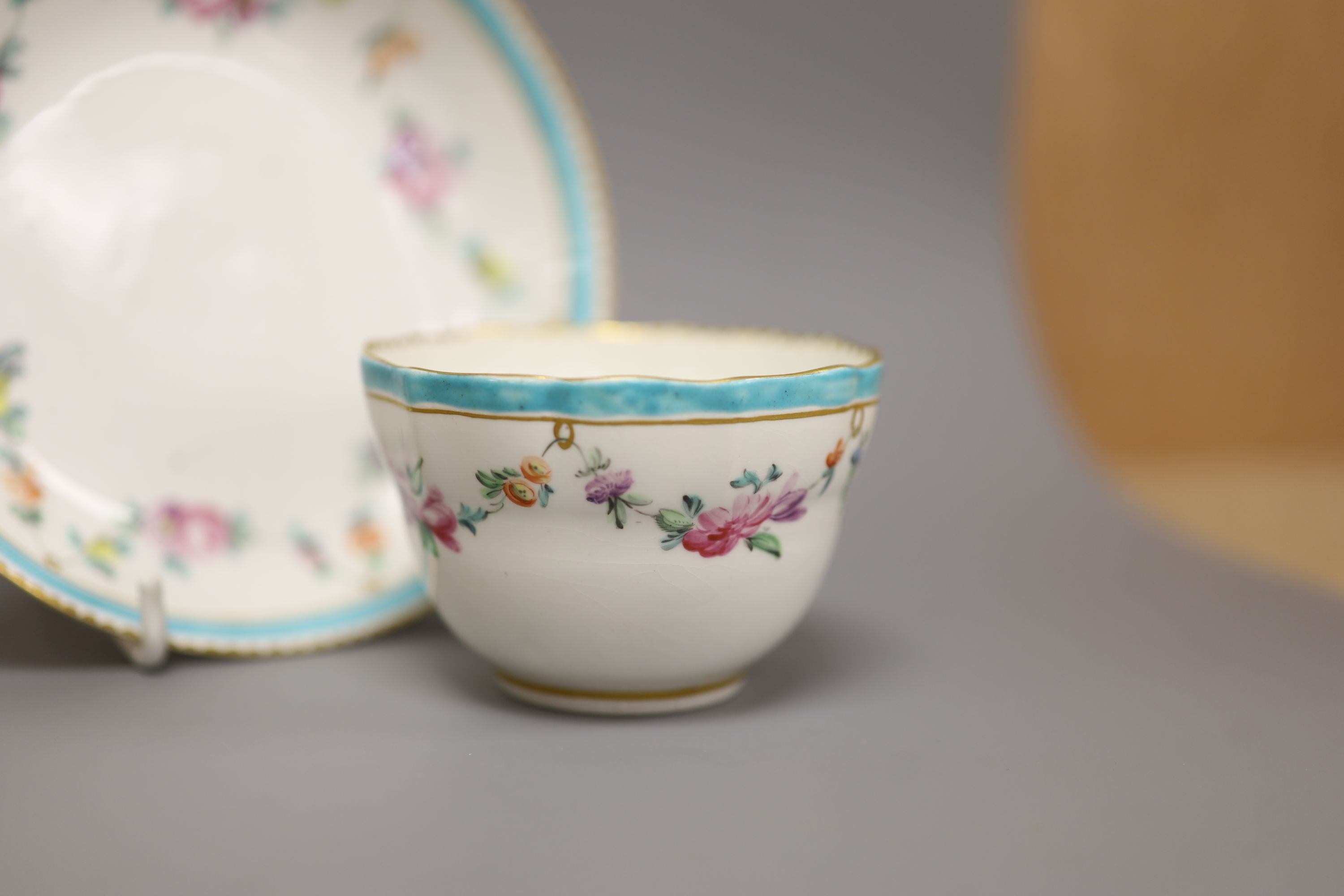 A Chelsea Derby teabowl and saucer painted with flowers, c.1778, blue Crown Derby mark with no batons, diameter 13cm